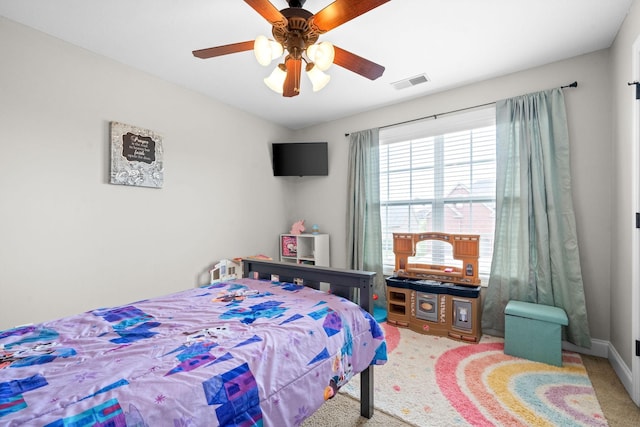 bedroom with a ceiling fan, visible vents, and carpet flooring