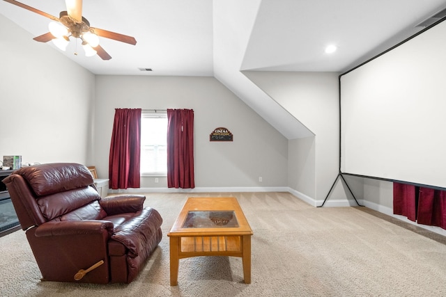 interior space featuring lofted ceiling, carpet floors, visible vents, and baseboards