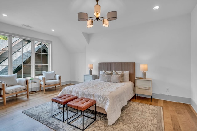 bedroom with recessed lighting, wood finished floors, visible vents, and baseboards