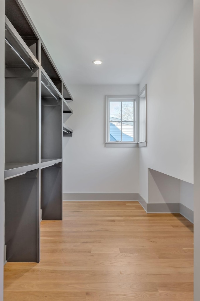 walk in closet featuring light wood finished floors