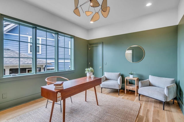 home office featuring wood finished floors and recessed lighting