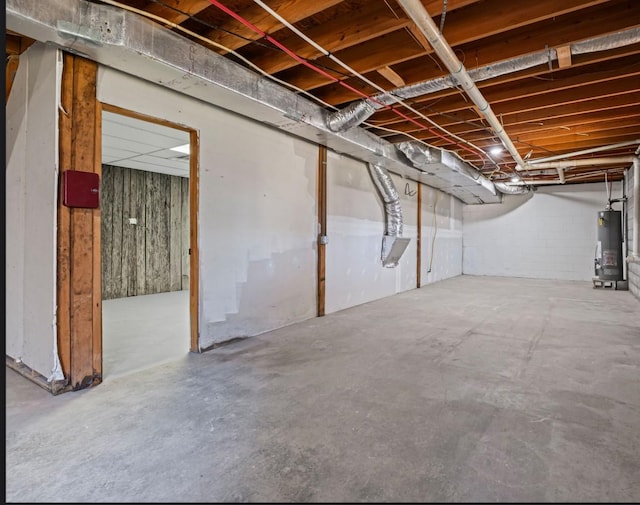 unfinished basement with gas water heater