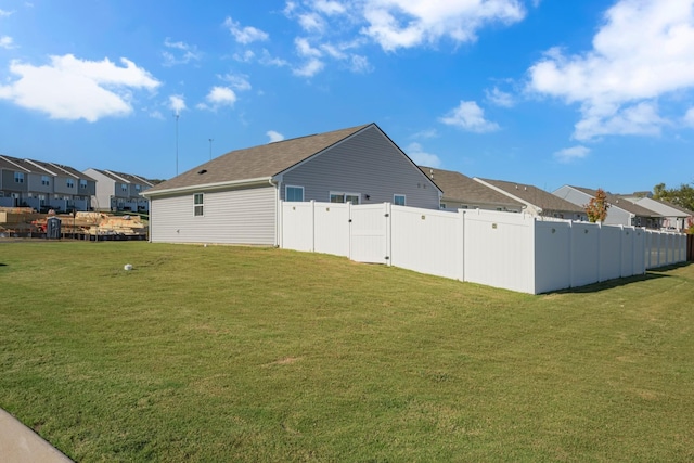 exterior space featuring a residential view and fence