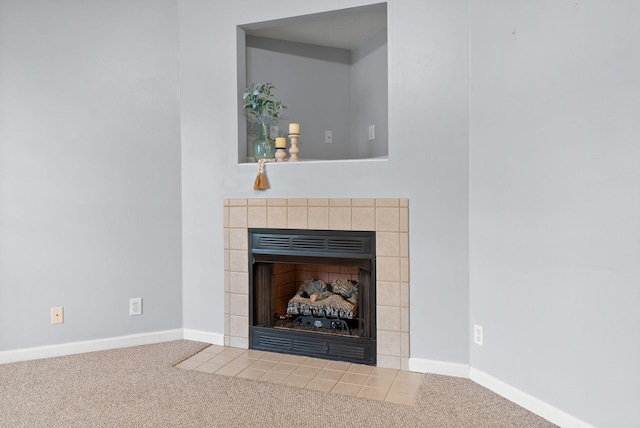 details with carpet, baseboards, and a tile fireplace