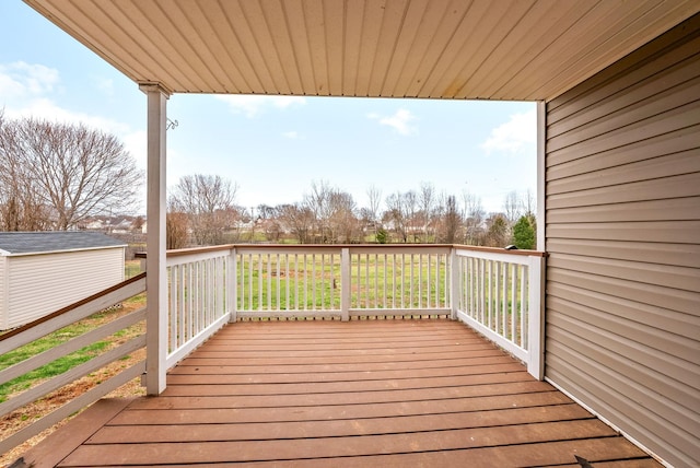 wooden deck with an outdoor structure