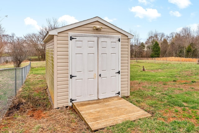 view of shed with fence