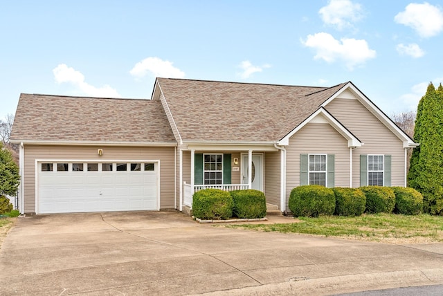 single story home featuring a garage, concrete driveway, roof with shingles, and covered porch