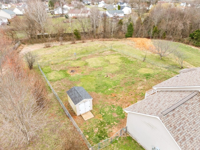 birds eye view of property with a residential view