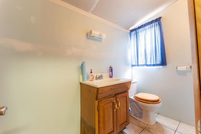 bathroom featuring vanity, toilet, and tile patterned floors