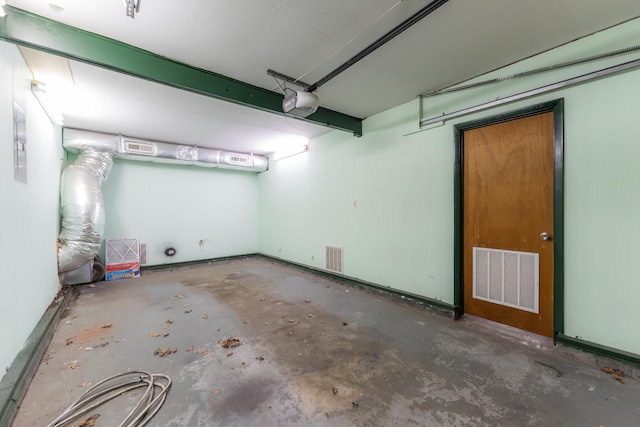 garage featuring visible vents and a garage door opener