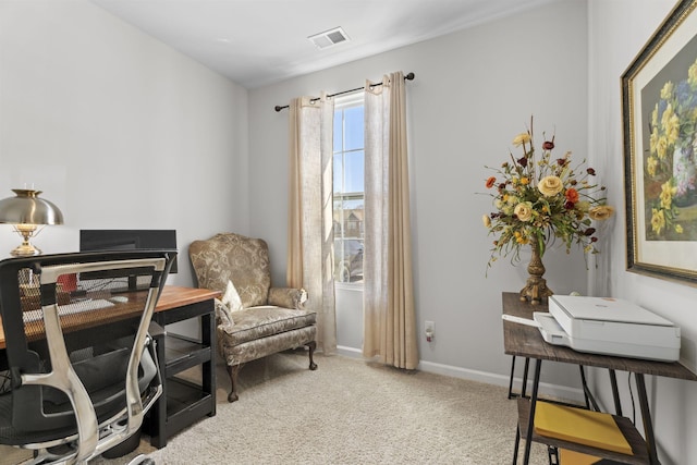 office space with light carpet, visible vents, and baseboards