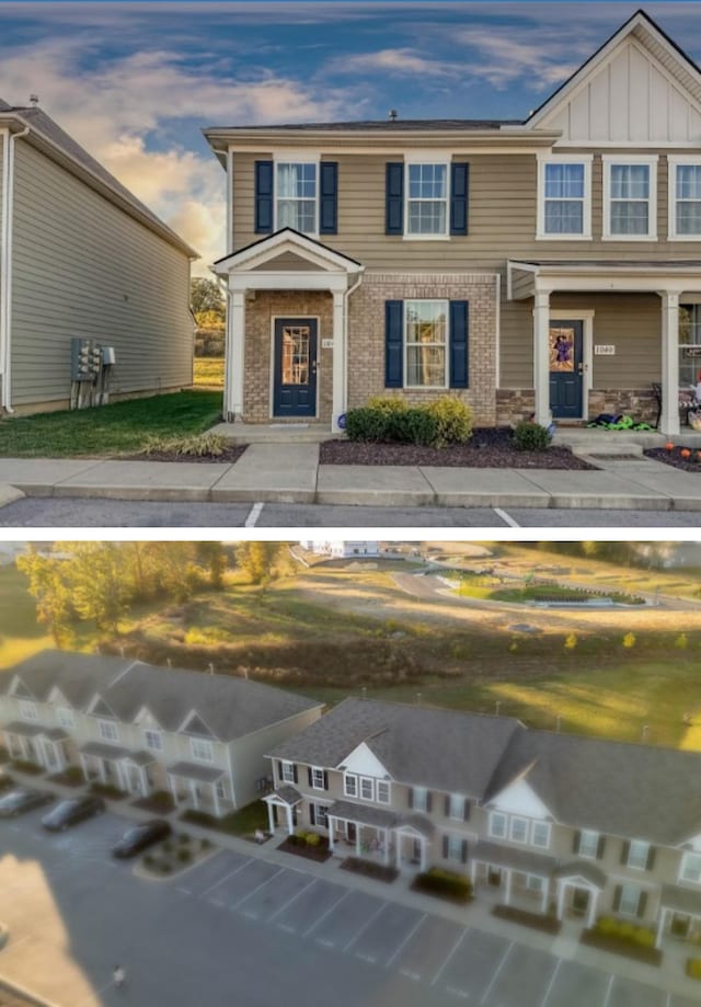 view of front of home with board and batten siding and brick siding