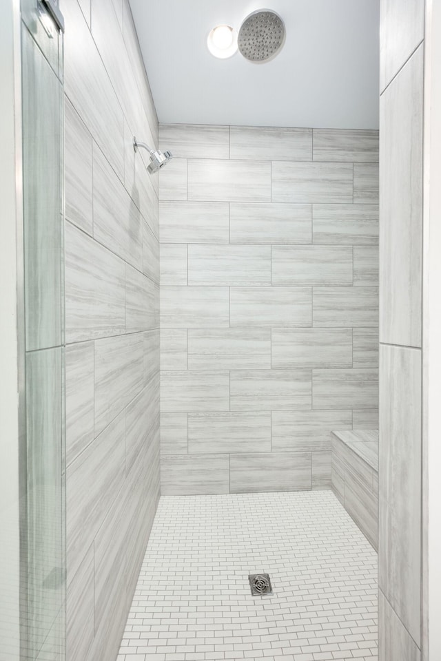 bathroom with a tile shower