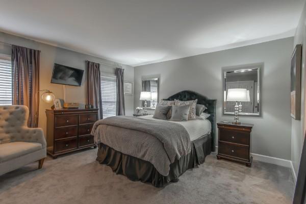 bedroom featuring carpet and baseboards