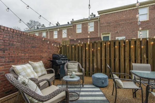 view of patio featuring area for grilling and fence