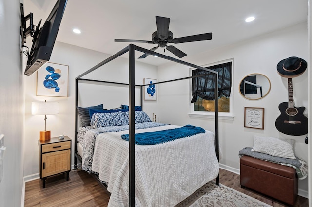 bedroom featuring a ceiling fan, baseboards, wood finished floors, and recessed lighting