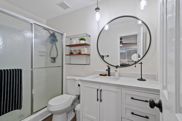 bathroom with a stall shower, visible vents, radiator, toilet, and vanity