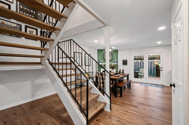 stairs with recessed lighting, baseboards, wood finished floors, and french doors