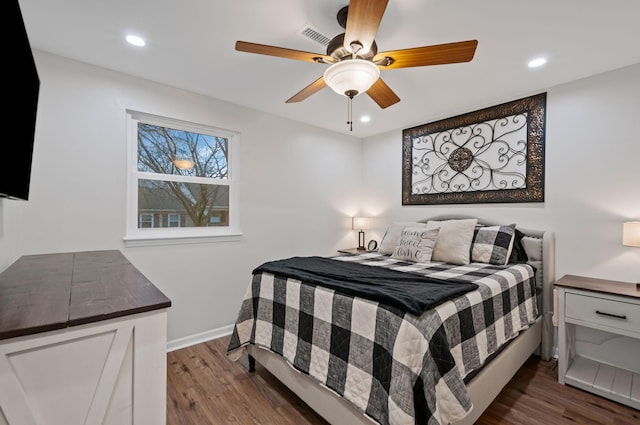 bedroom with baseboards, visible vents, dark wood-style flooring, and recessed lighting