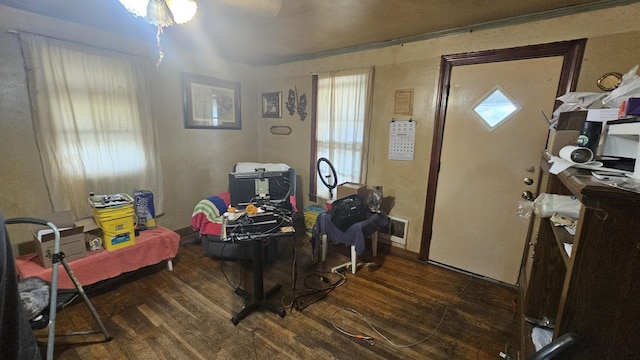 office area with visible vents and wood finished floors