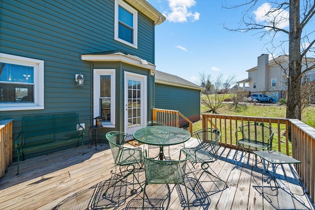 wooden deck featuring outdoor dining space