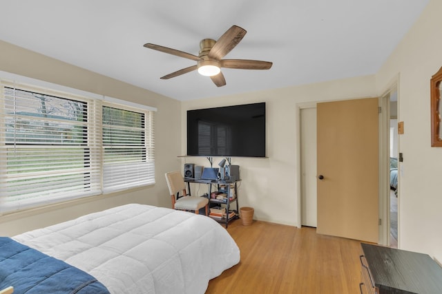 bedroom featuring a ceiling fan and light wood-type flooring