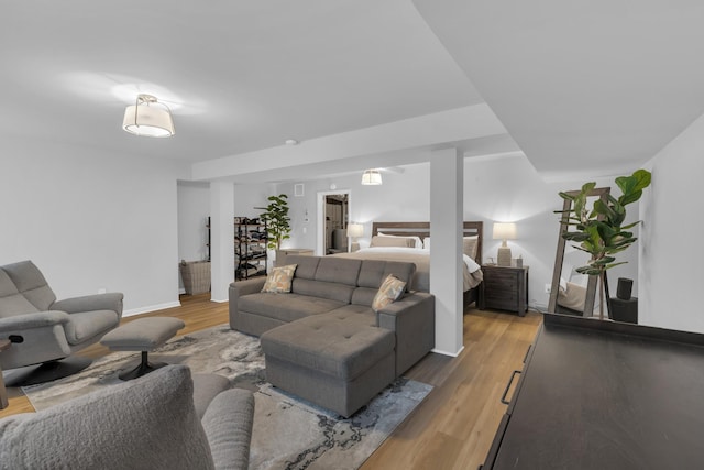 living room with light wood finished floors and baseboards