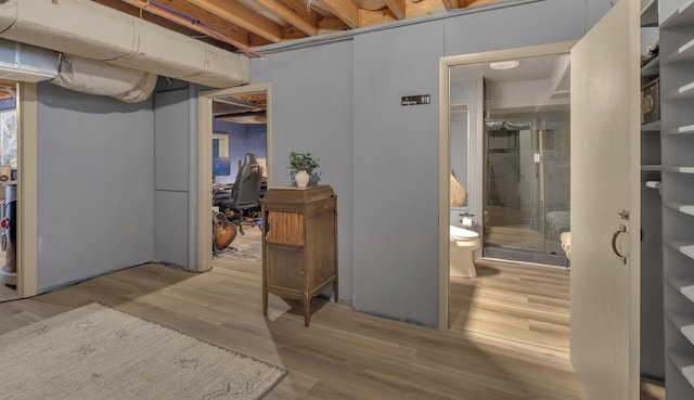 unfinished basement with wood finished floors