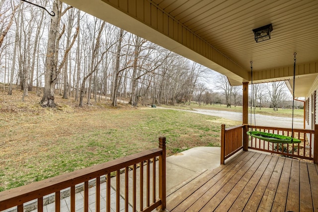 wooden terrace with a yard