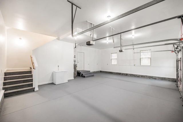 garage featuring baseboards and a garage door opener