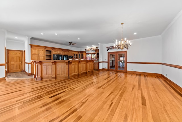 unfurnished living room featuring light wood finished floors, baseboards, crown molding, and recessed lighting