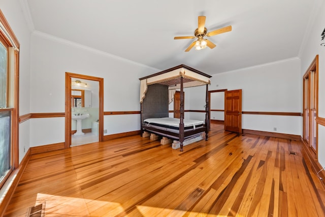 bedroom with light wood finished floors, baseboards, visible vents, and ornamental molding