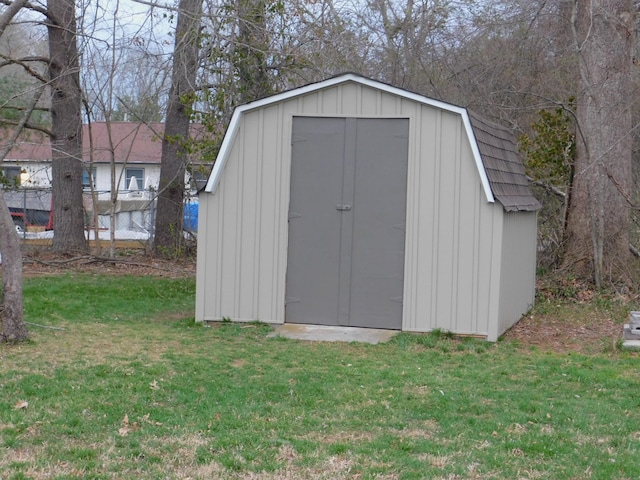 view of shed featuring fence