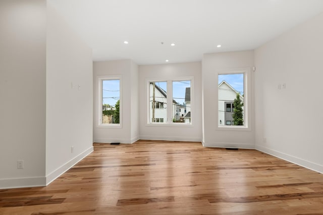 interior space with recessed lighting, baseboards, and light wood finished floors