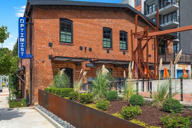 exterior space featuring brick siding