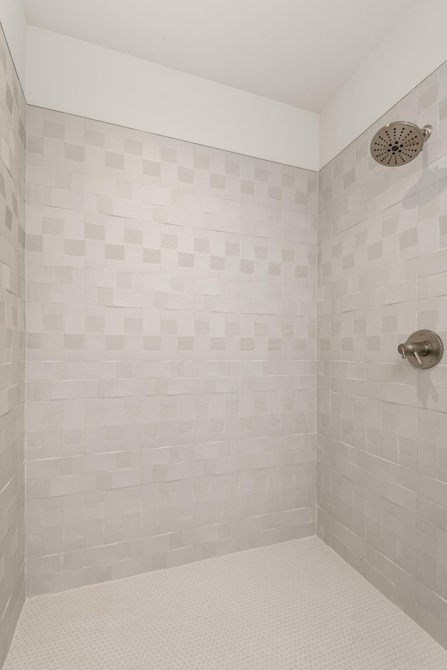 bathroom with a tile shower