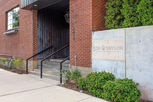 exterior space featuring brick siding