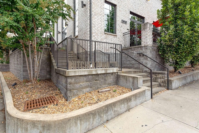 view of side of property featuring brick siding