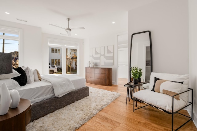 bedroom featuring ceiling fan, recessed lighting, visible vents, and light wood-style floors