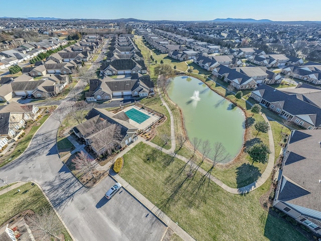 birds eye view of property featuring a water view and a residential view