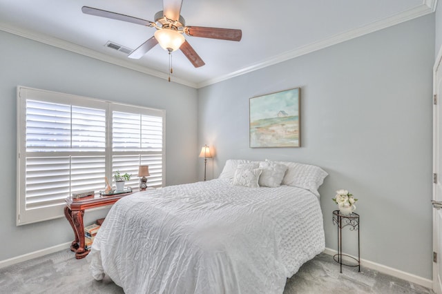 bedroom with carpet floors, visible vents, ornamental molding, and baseboards