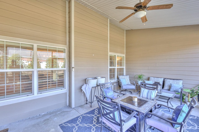 view of patio / terrace with ceiling fan and an outdoor living space