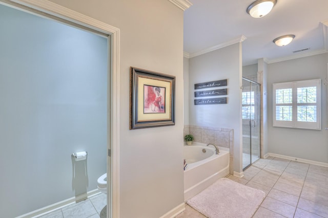 bathroom featuring toilet, ornamental molding, a stall shower, a bath, and tile patterned floors