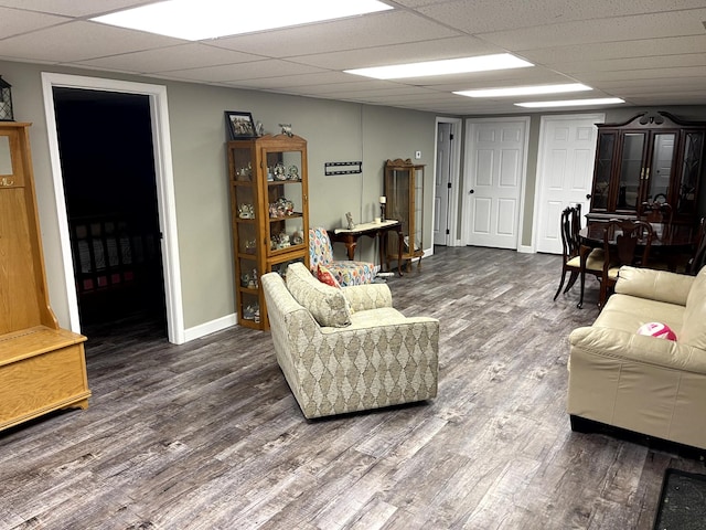 579 Old Celina Rd, Allons, TN 38541 - living room featuring a paneled ceiling, baseboards, and wood finished floors