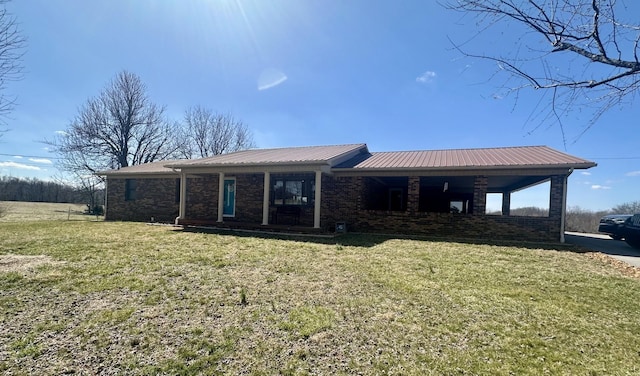 579 Old Celina Rd, Allons, TN 38541 - view of front of property featuring metal roof, brick siding, and a front yard