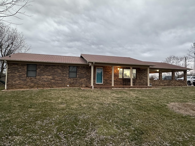 579 Old Celina Rd, Allons, TN 38541 - view of front facade with a front lawn, metal roof, and brick siding