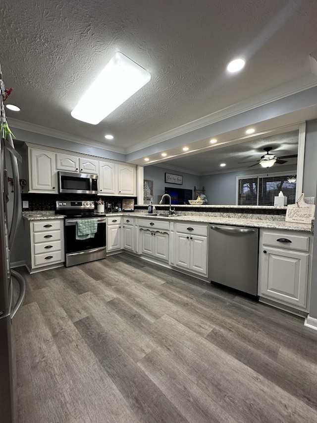 579 Old Celina Rd, Allons, TN 38541 - kitchen with stainless steel appliances, dark wood-style flooring, and crown molding