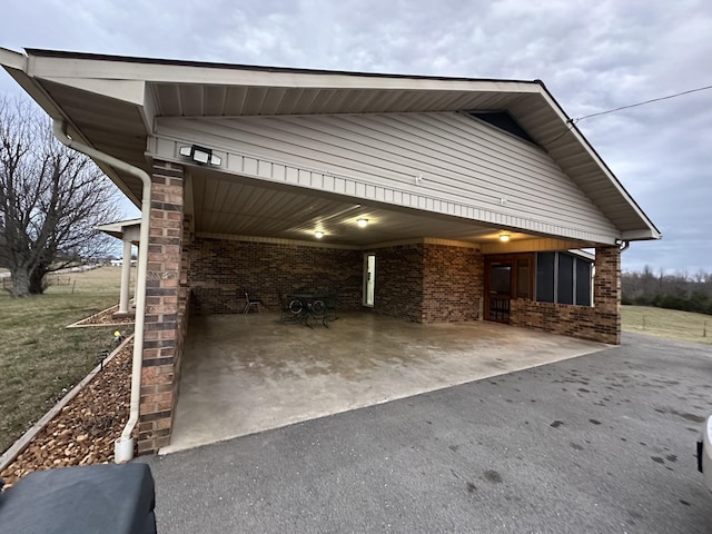 579 Old Celina Rd, Allons, TN 38541 - exterior space featuring driveway, a carport, and brick siding