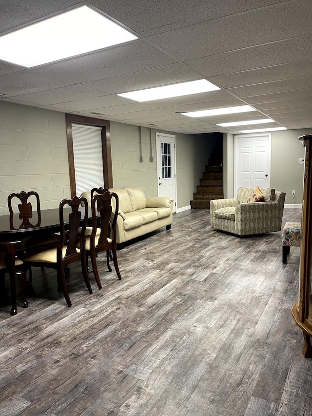 579 Old Celina Rd, Allons, TN 38541 - living area with concrete block wall, stairs, baseboards, and wood finished floors