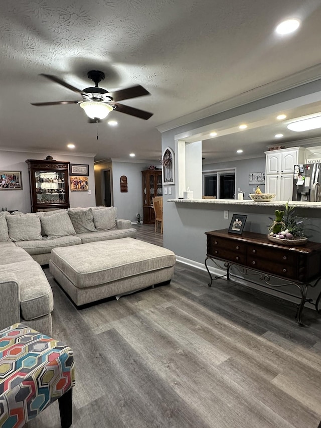 579 Old Celina Rd, Allons, TN 38541 - living room featuring a textured ceiling, recessed lighting, wood finished floors, and crown molding
